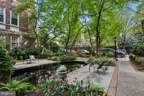 a view of a backyard with sitting area