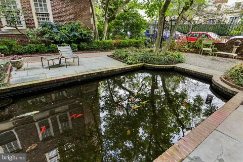 a view of swimming pool with a patio