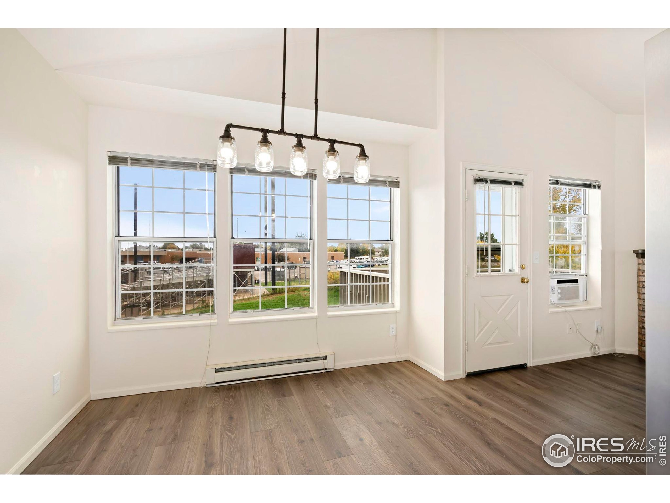 2828 Silverplume Drive, Unit R3 Fort Collins, CO 80526 - Photo 12 of 44 a view interior of a house wooden floor an entryway and windows