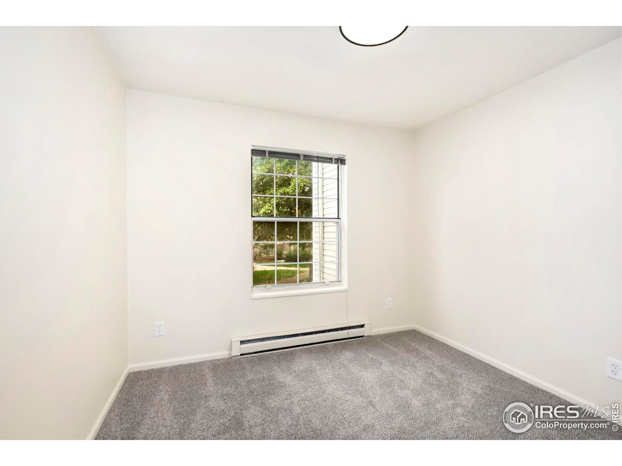 2828 Silverplume Drive, Unit R3 Fort Collins, CO 80526 - Photo 20 of 44 a view of an empty room with a window