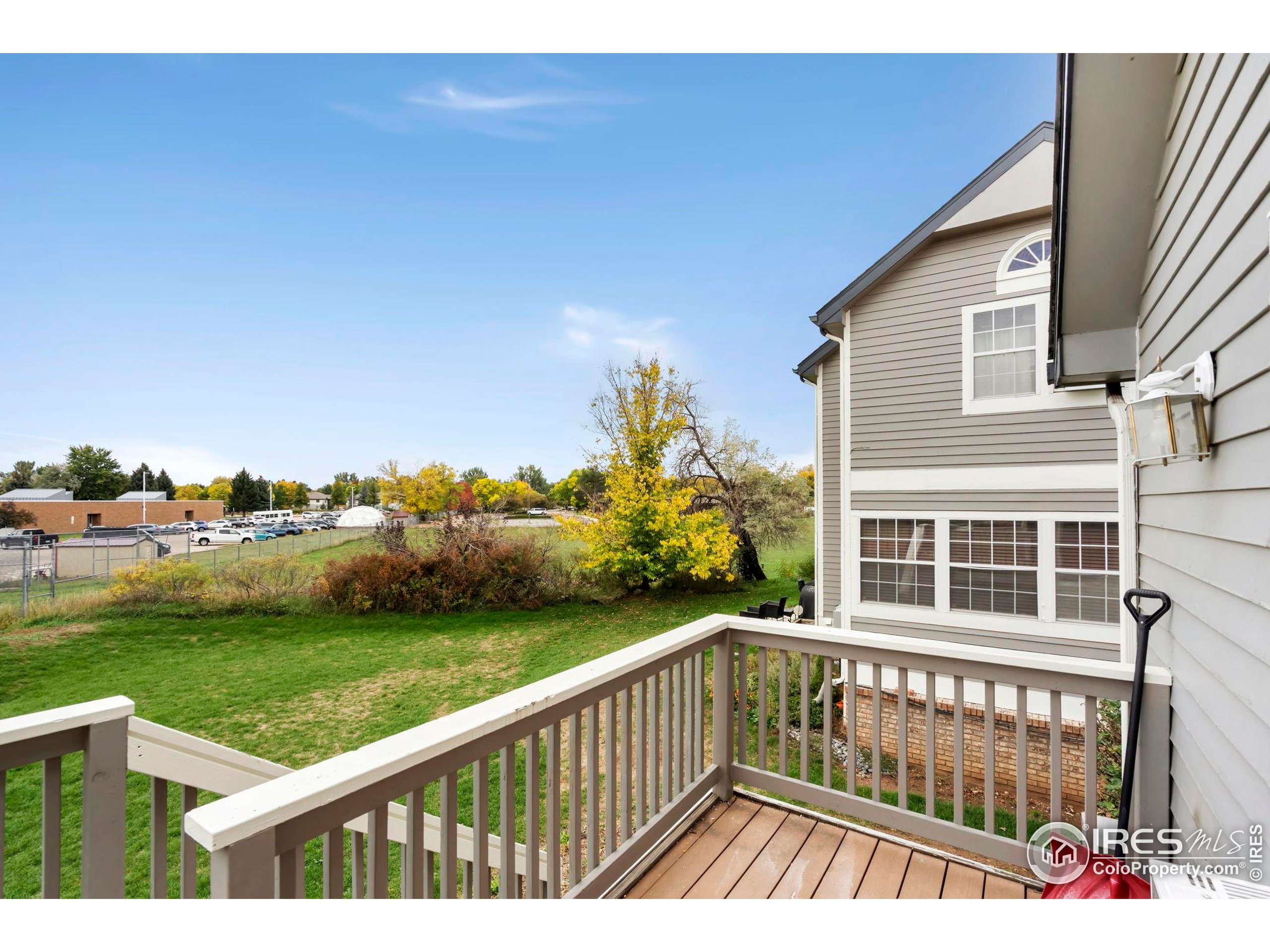 2828 Silverplume Drive, Unit R3 Fort Collins, CO 80526 - Photo 29 of 44 a view of a wooden deck and a yard