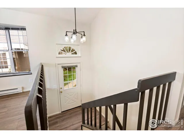 a view of a hallway with windows