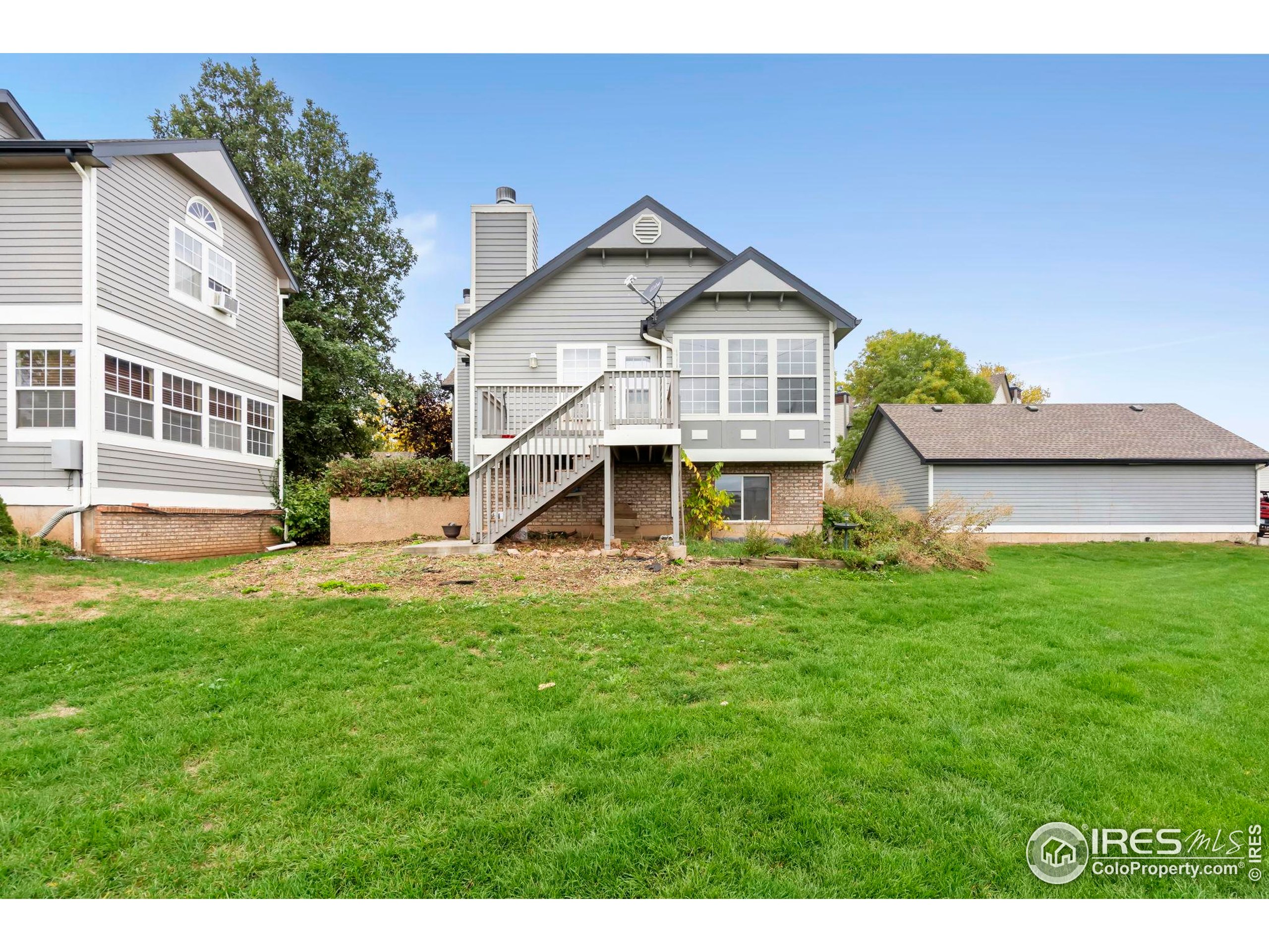 2828 Silverplume Drive, Unit R3 Fort Collins, CO 80526 - Photo 33 of 44 a front view of a house with a yard