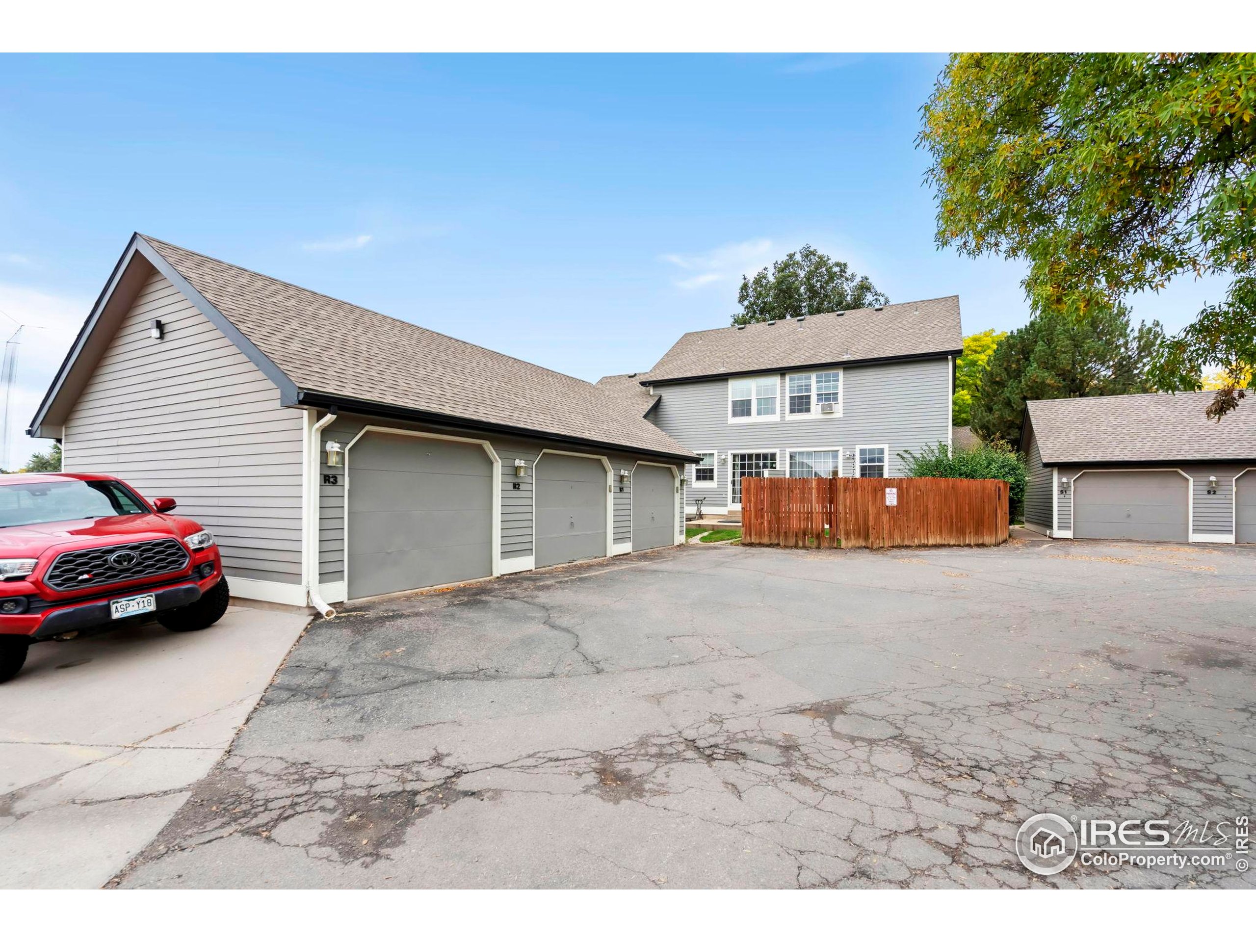 2828 Silverplume Drive, Unit R3 Fort Collins, CO 80526 - Photo 38 of 44 a view of garage with a car parked in front of it
