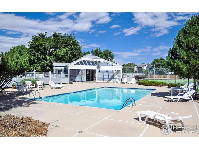 a house with swimming pool in front of it