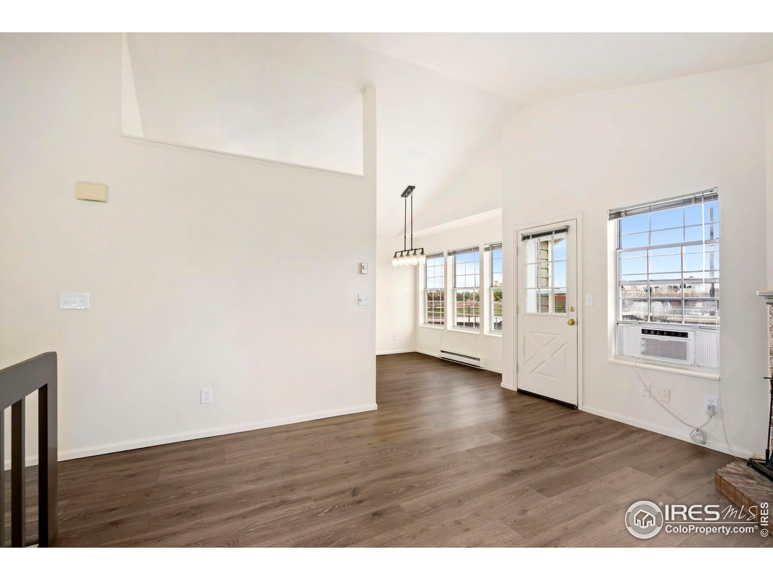 2828 Silverplume Drive, Unit R3 Fort Collins, CO 80526 - Photo 6 of 44 a view of an empty room with wooden floor