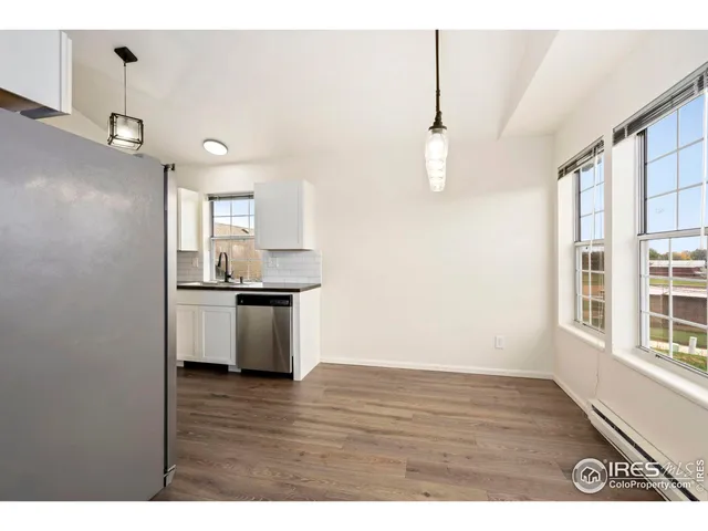 a view of a kitchen with a sink cabinet and a window