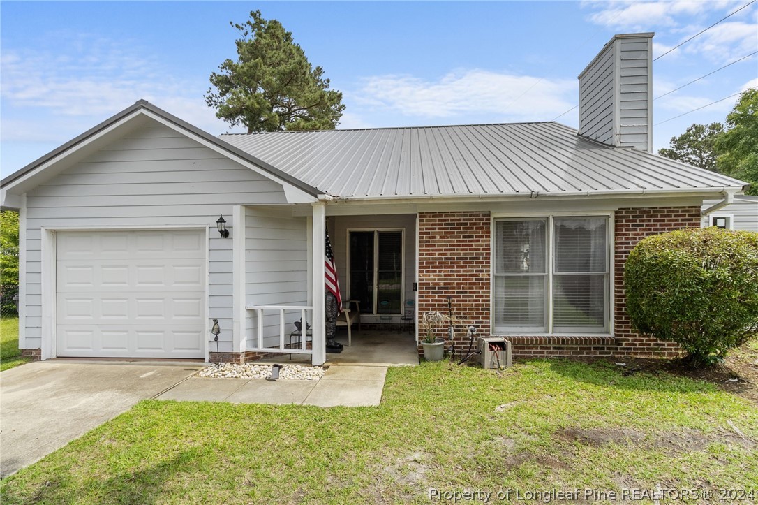 5334 Tory Hill Road Hope Mills, NC 28348 - Photo 1 of 27 front view of a house with yard