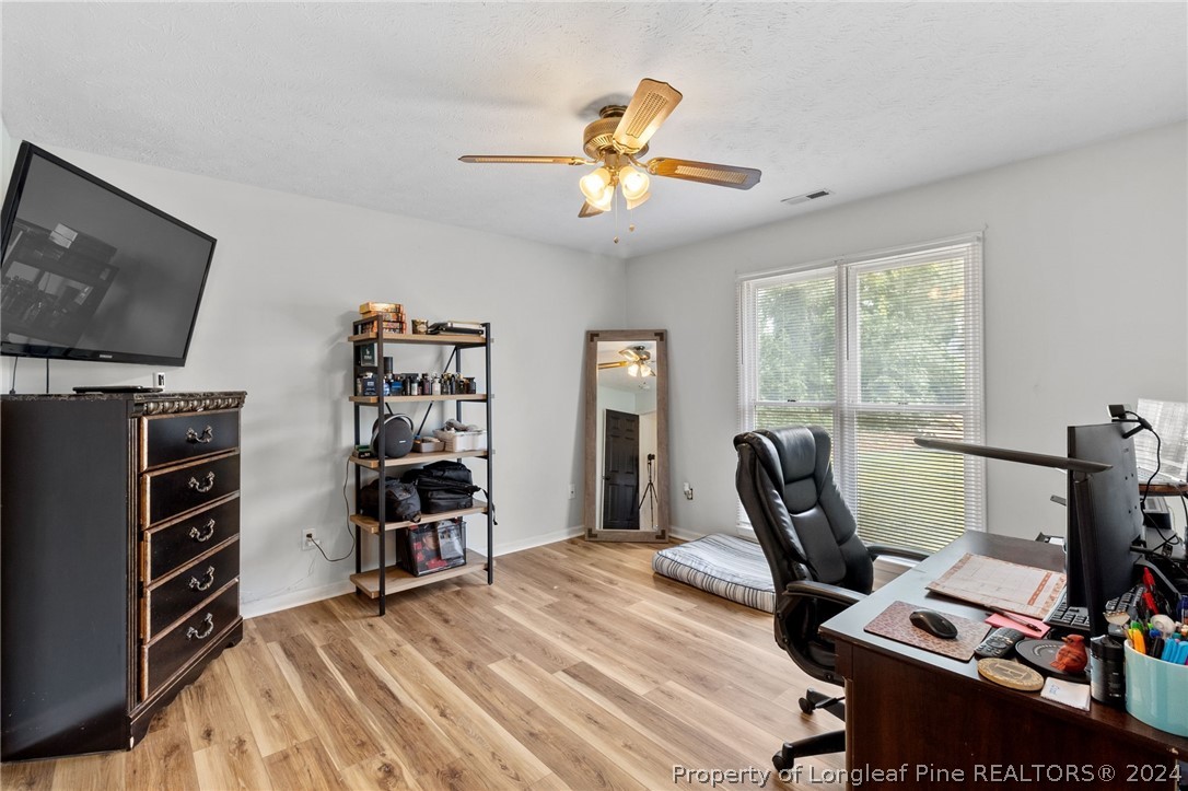5334 Tory Hill Road Hope Mills, NC 28348 - Photo 18 of 27 a view of a workspace with furniture and a window