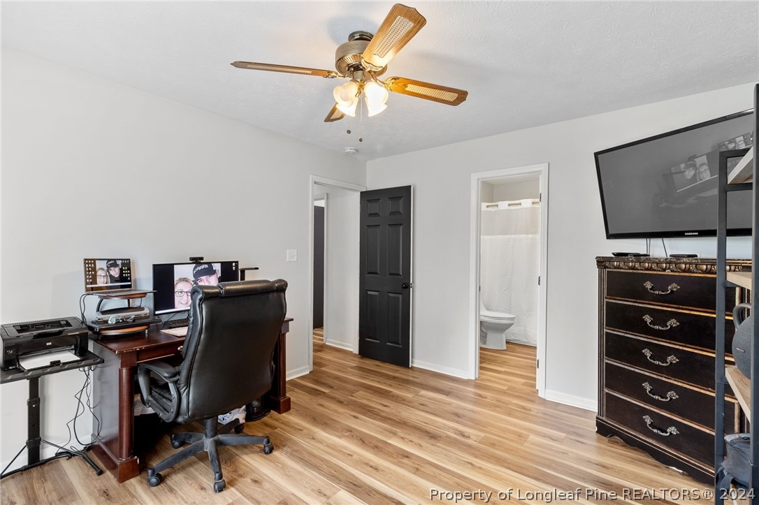 5334 Tory Hill Road Hope Mills, NC 28348 - Photo 19 of 27 a view of a workspace with furniture and gym equipment