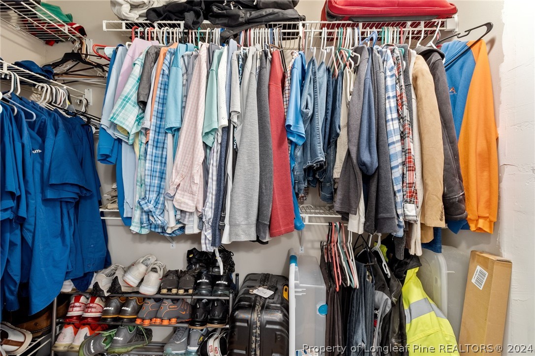 5334 Tory Hill Road Hope Mills, NC 28348 - Photo 21 of 27 a view of walk in closet with clothes