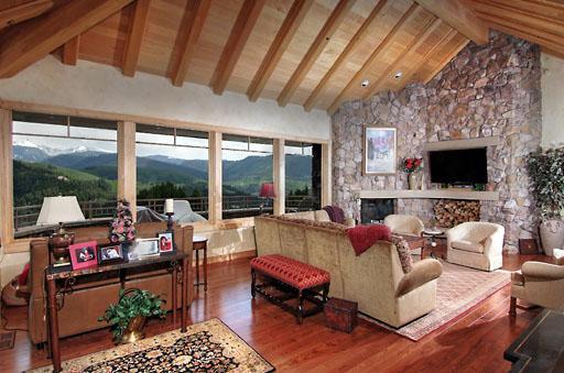 170 Casteel Ridge Edwards, CO 81632 - Photo 3 of 24 a living room with furniture a flat screen tv and a fireplace