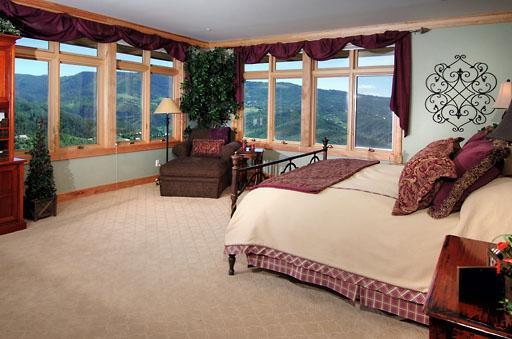 170 Casteel Ridge Edwards, CO 81632 - Photo 7 of 24 a bedroom with a bed and large windows
