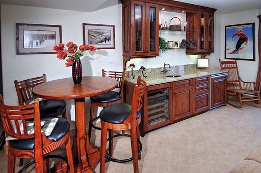 170 Casteel Ridge Edwards, CO 81632 - Photo 10 of 24 a dining room filled chandelier and wooden furniture