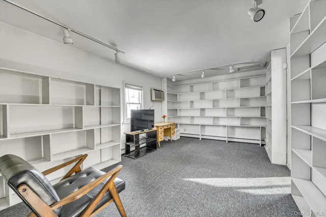 a view of a livingroom with furniture