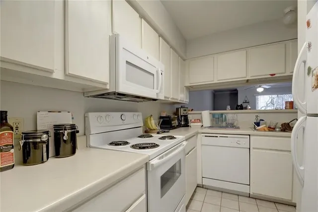 a kitchen with appliances cabinets and a sink