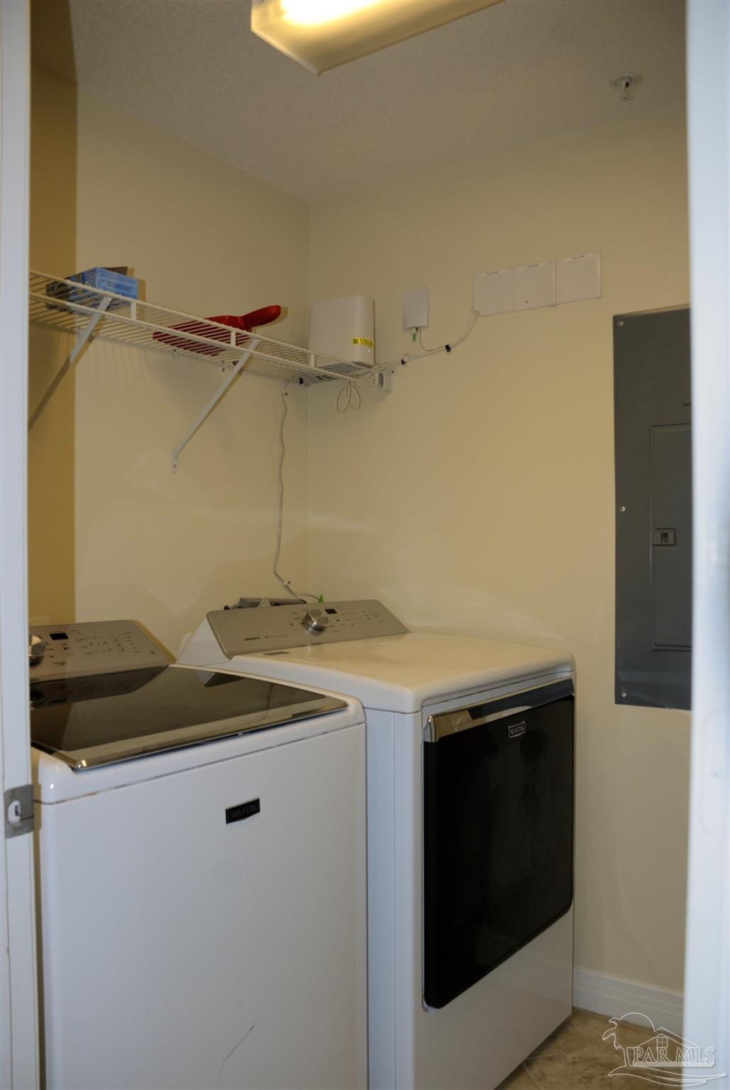 8501 Gulf Boulevard, Unit 10F Navarre, FL 32566 - Photo 27 of 35 a utility room with dryer and washer