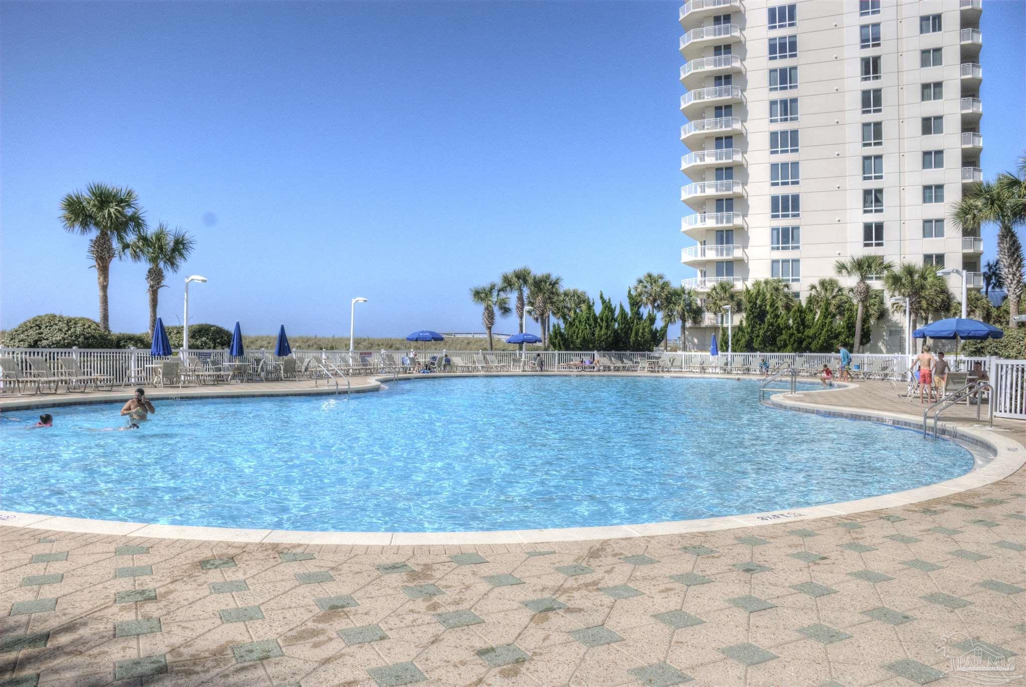 8501 Gulf Boulevard, Unit 10F Navarre, FL 32566 - Photo 28 of 35 a view of a swimming pool and a yard