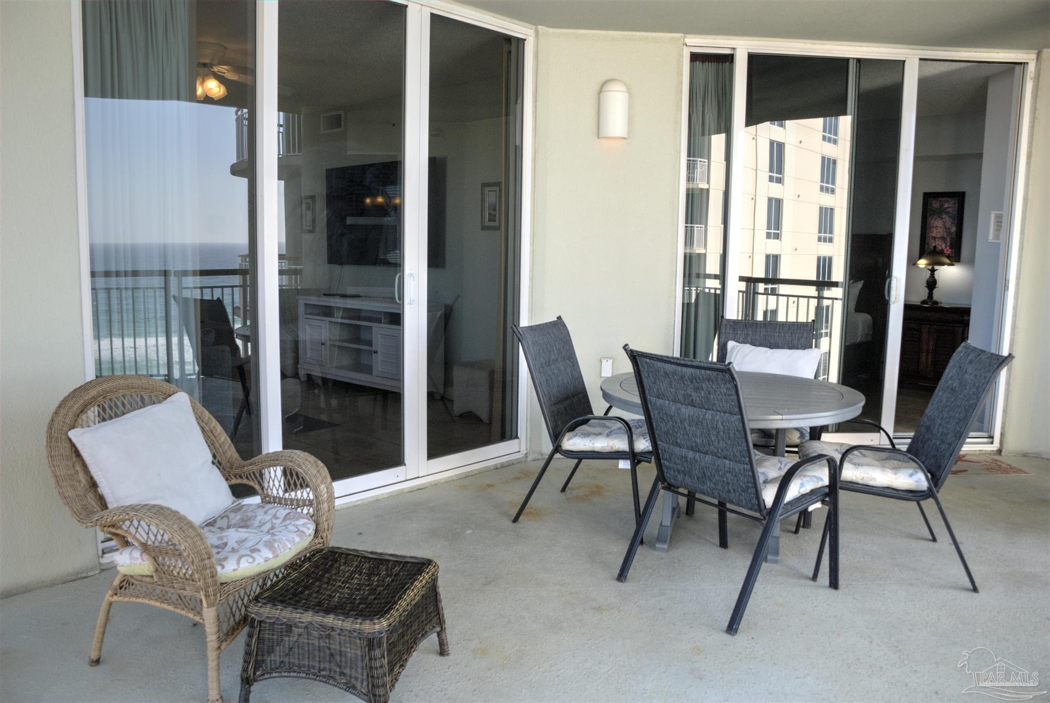 8501 Gulf Boulevard, Unit 10F Navarre, FL 32566 - Photo 6 of 35 a view of a dining room with furniture and a window