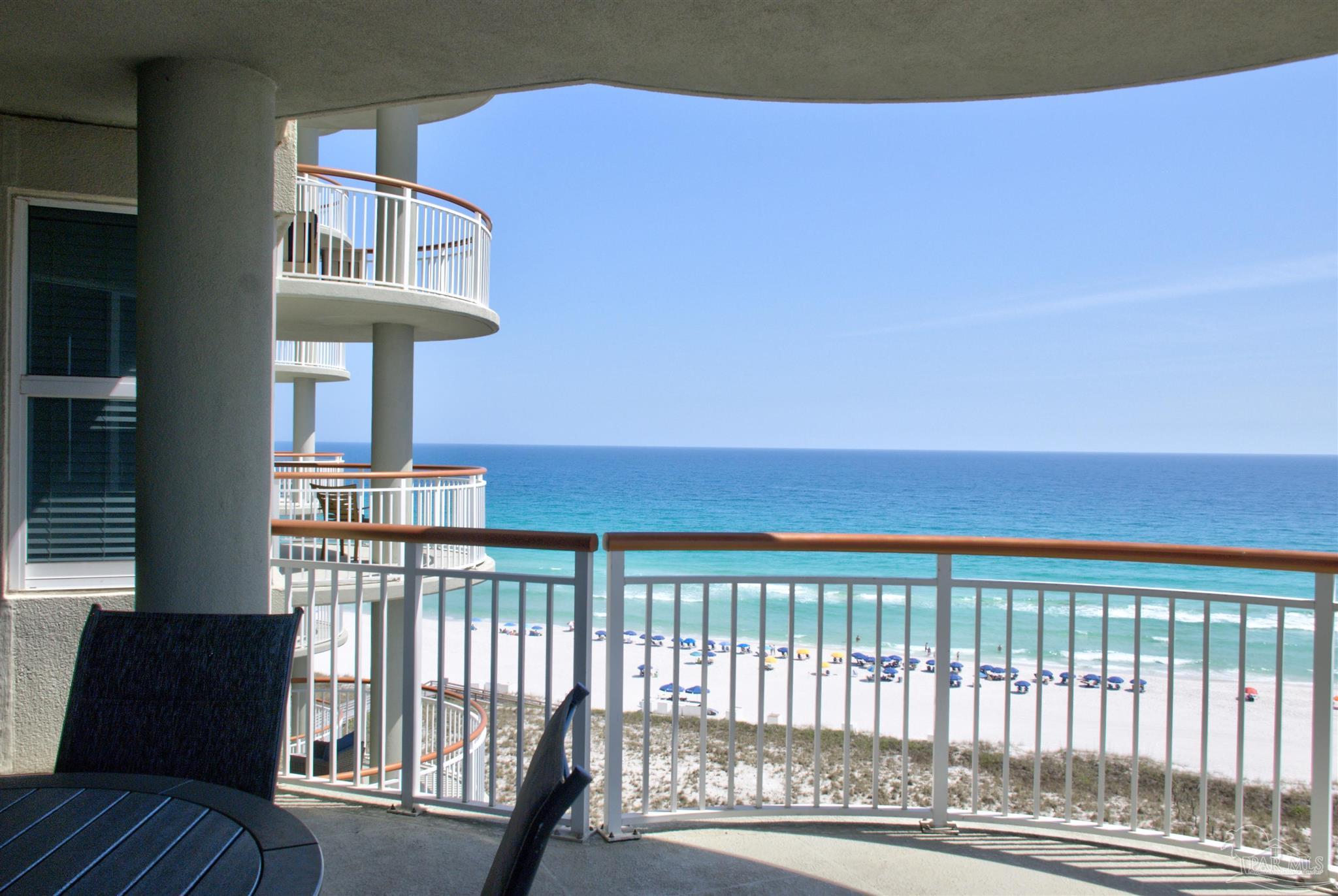8501 Gulf Boulevard, Unit 10F Navarre, FL 32566 - Photo 7 of 35 a view of a chairs and table on the deck