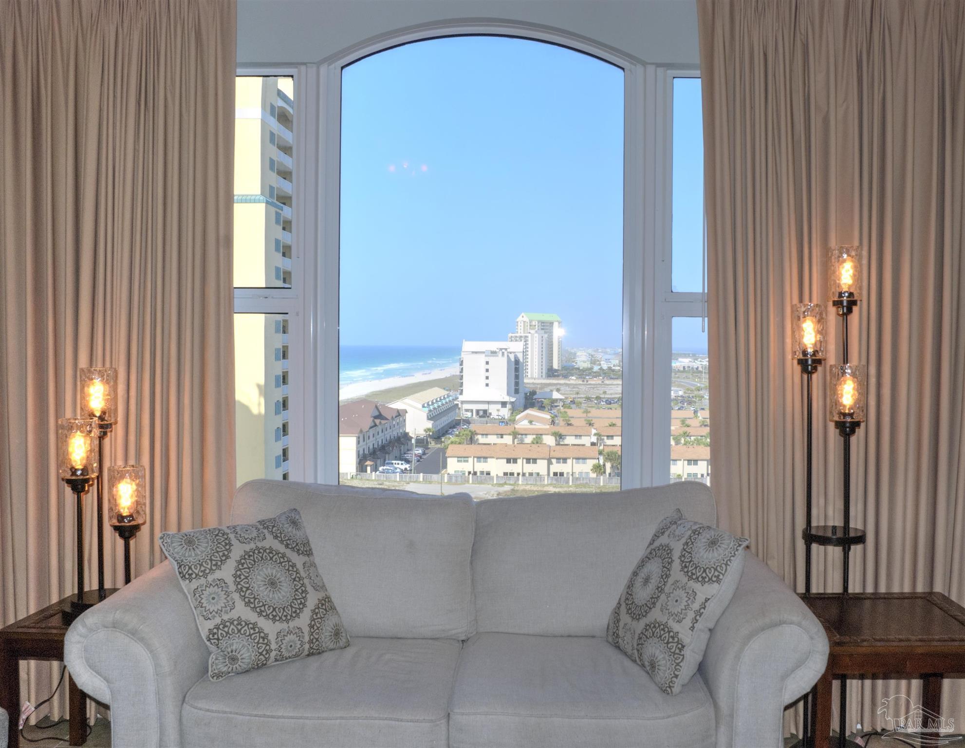 8501 Gulf Boulevard, Unit 10F Navarre, FL 32566 - Photo 10 of 35 a living room with furniture and a large window