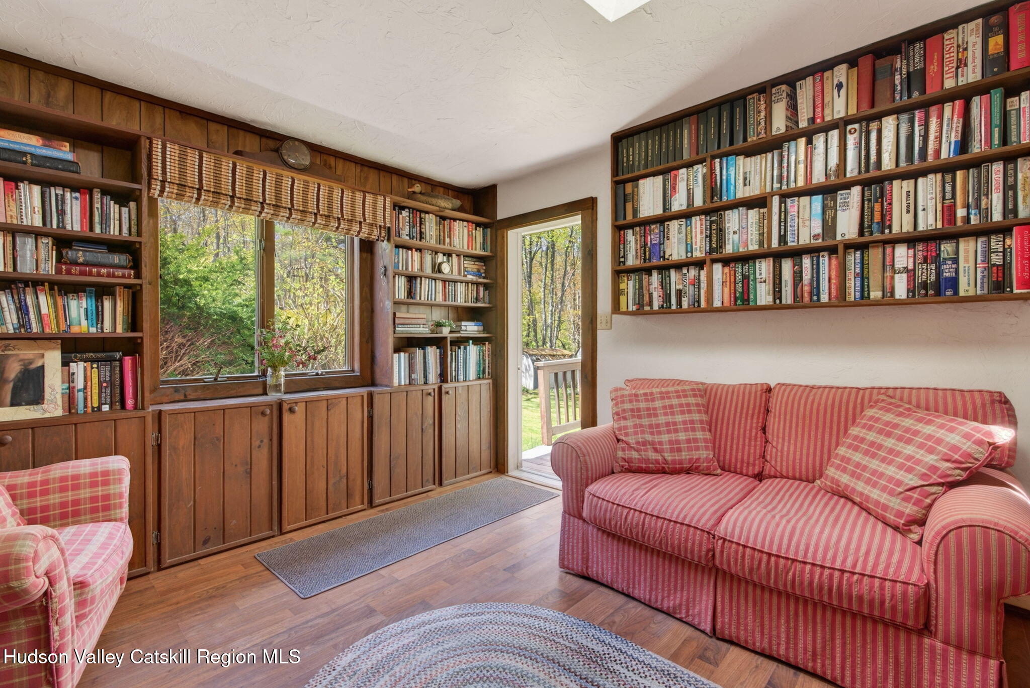 689 Old Road Windham, NY 12496 - Photo 20 of 42 a living room with furniture and a book shelf