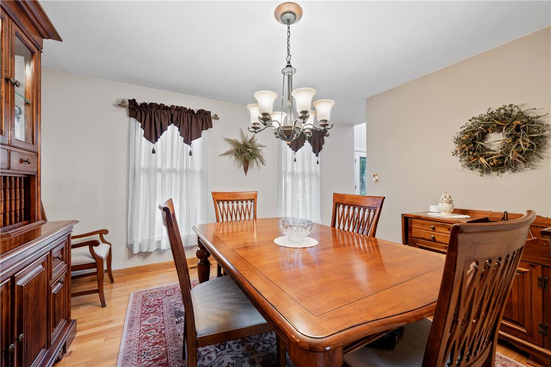 4568 Greenfield Road Bethlehem, PA 18017 - Photo 8 of 59 A classic dining area with hardwood floors, featuring a chandelier and ample natural light.