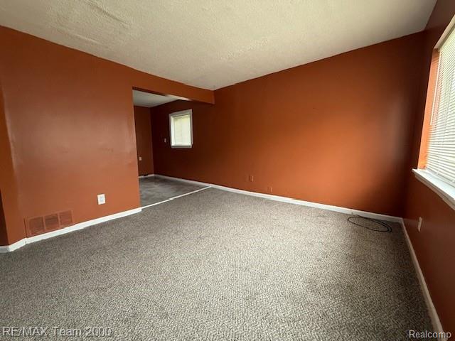 26174 Kitch Street Inkster, MI 48141 - Photo 2 of 8 Open-concept living space featuring textured carpeting and contrasting wall colors