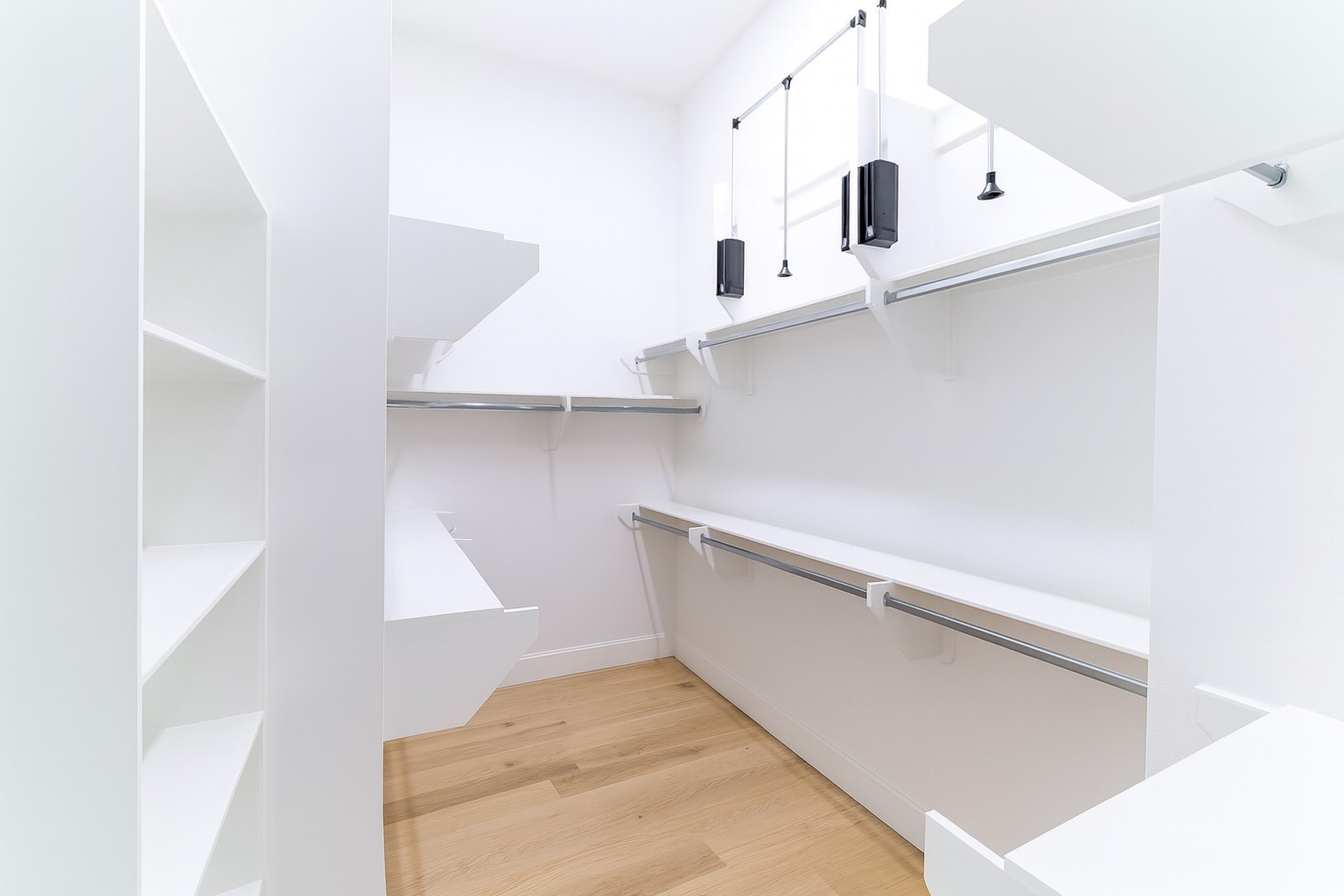 802 Cage Street Houston, TX 77020 - Photo 5 of 15 a view of an empty room with wooden floor and cabinets