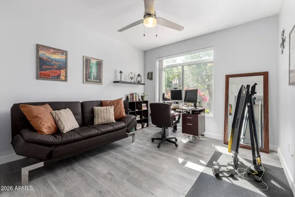 a view of a livingroom with workspace and a couch