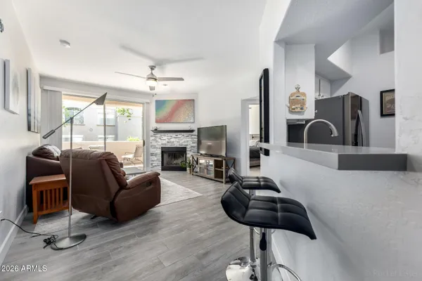 a living room with furniture and a fireplace