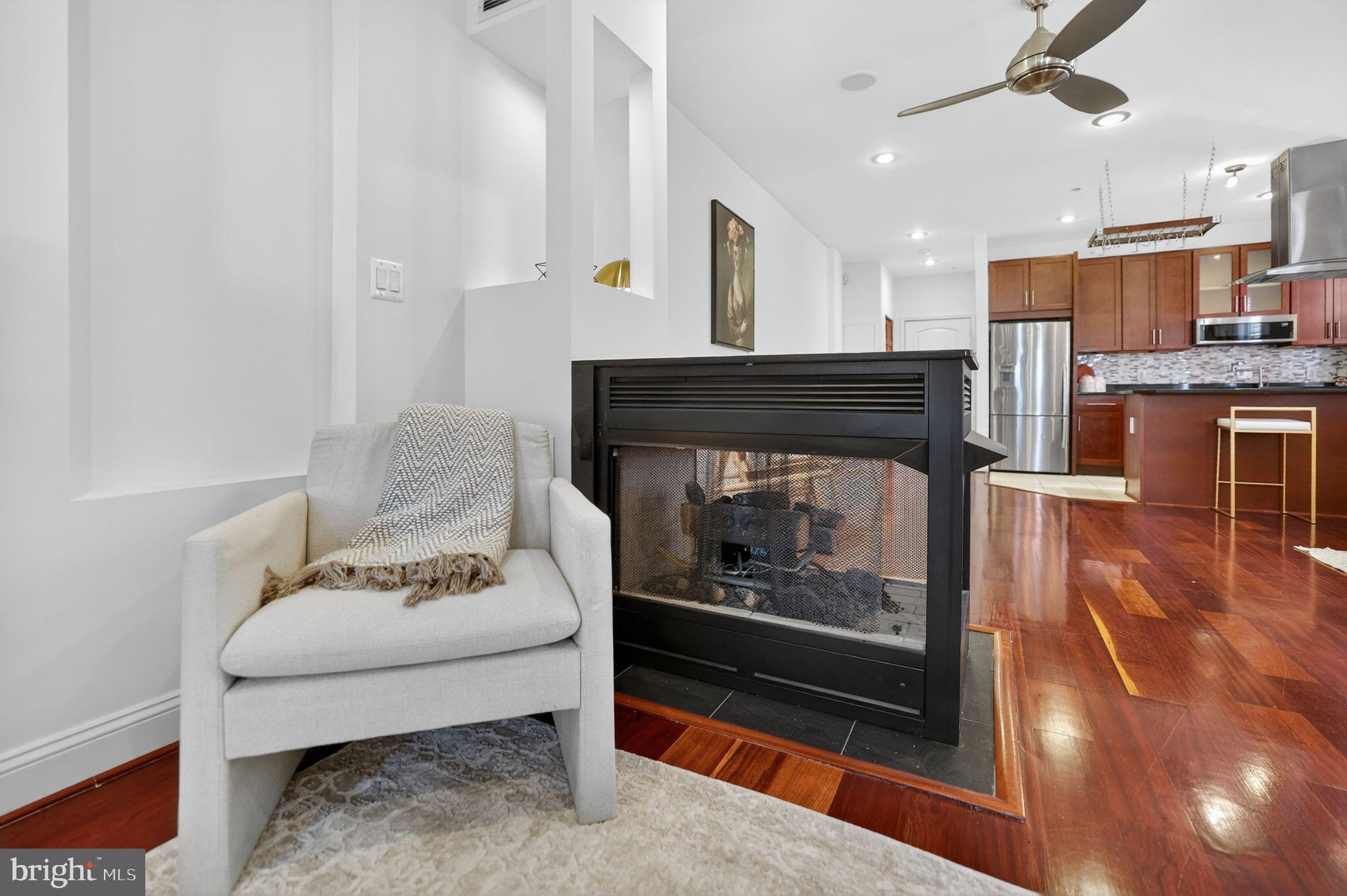 3573 Warder Street Northwest, Unit 7 Washington, DC 20010 - Photo 12 of 61 a living room with furniture and a fireplace