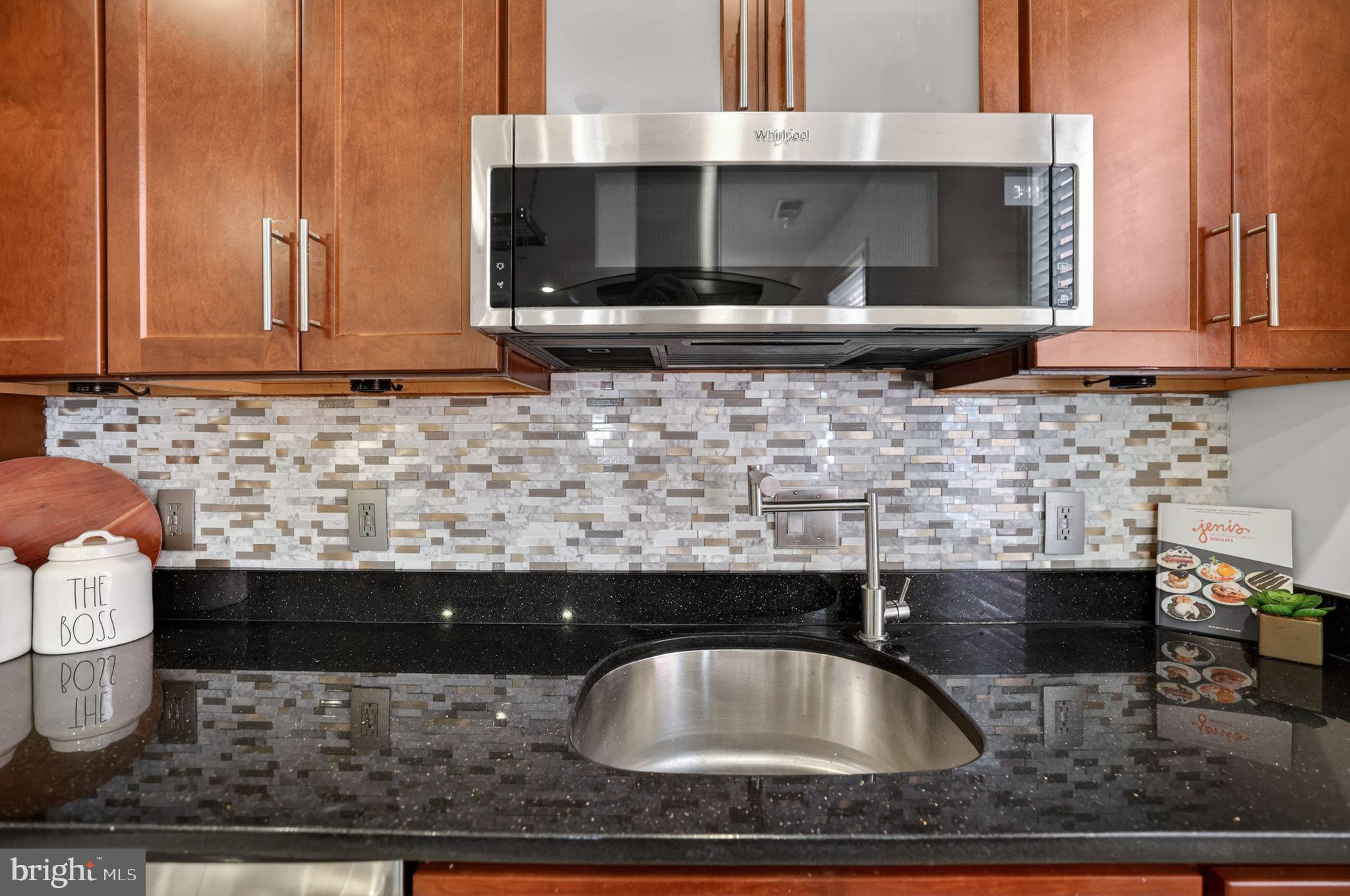 3573 Warder Street Northwest, Unit 7 Washington, DC 20010 - Photo 22 of 61 a kitchen with a sink and a microwave