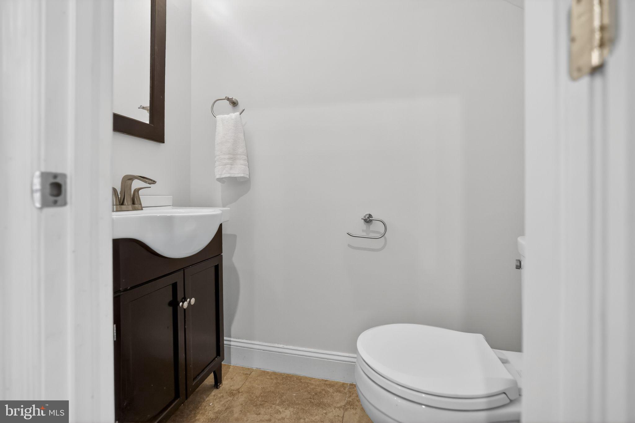 3573 Warder Street Northwest, Unit 7 Washington, DC 20010 - Photo 24 of 61 a bathroom with a sink and a toilet