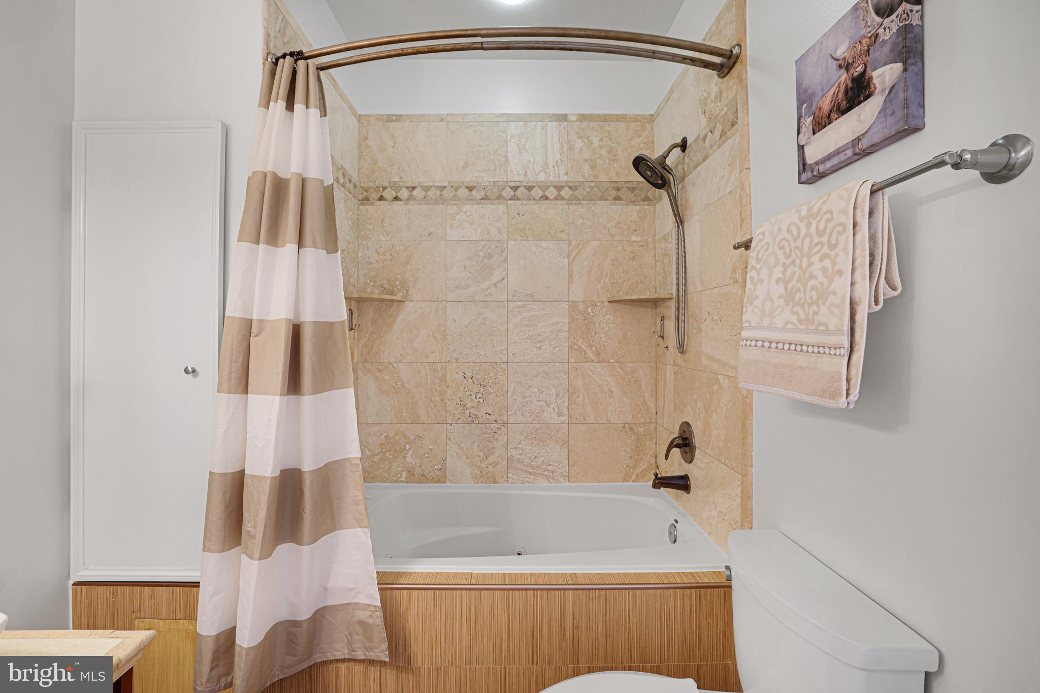 3573 Warder Street Northwest, Unit 7 Washington, DC 20010 - Photo 38 of 61 a bathroom with a shower and a bath tub