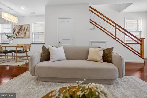 a large bedroom with a bed and window