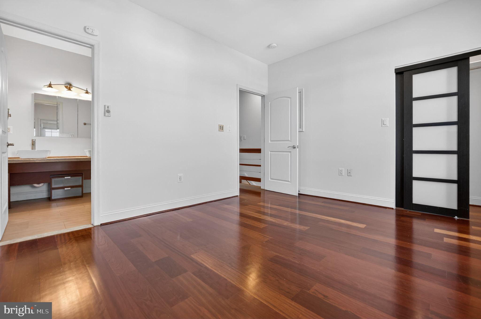 3573 Warder Street Northwest, Unit 7 Washington, DC 20010 - Photo 43 of 61 a view of a livingroom with wooden floor and a bathroom