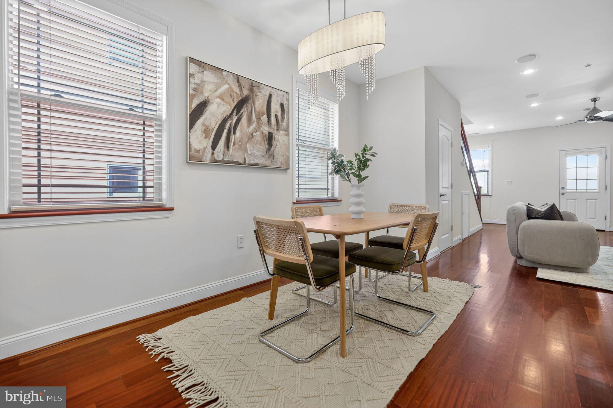 3573 Warder Street Northwest, Unit 7 Washington, DC 20010 - Photo 7 of 61 a view of a dining room with furniture and wooden floor