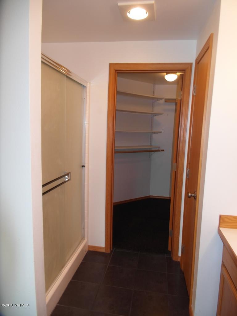 508 Canyon Road Yakima, WA 98901 - Photo 16 of 31 a view of walk in closet with empty racks