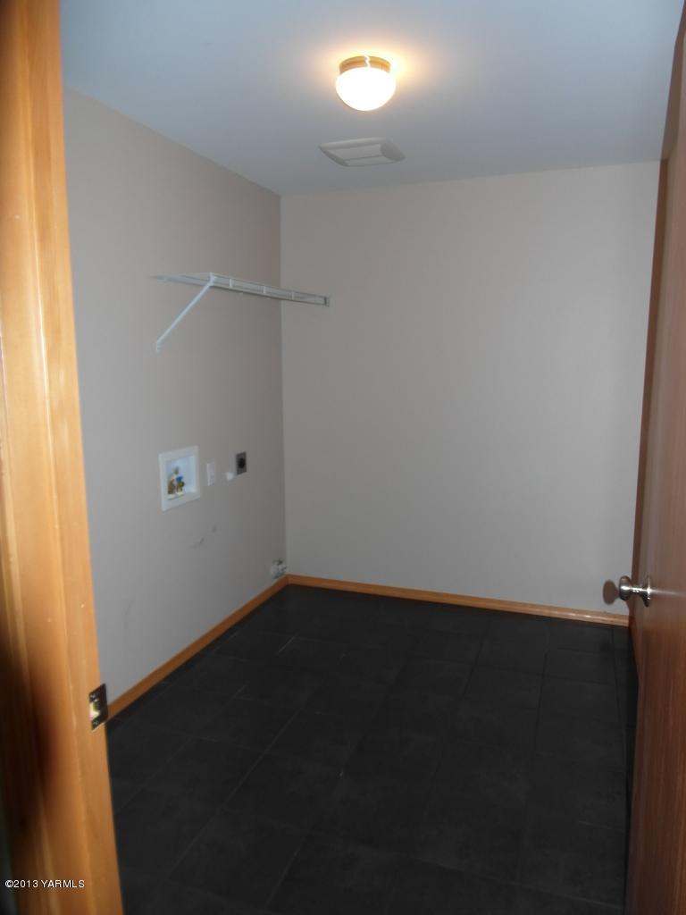 508 Canyon Road Yakima, WA 98901 - Photo 24 of 31 an empty room with a wooden door and a window