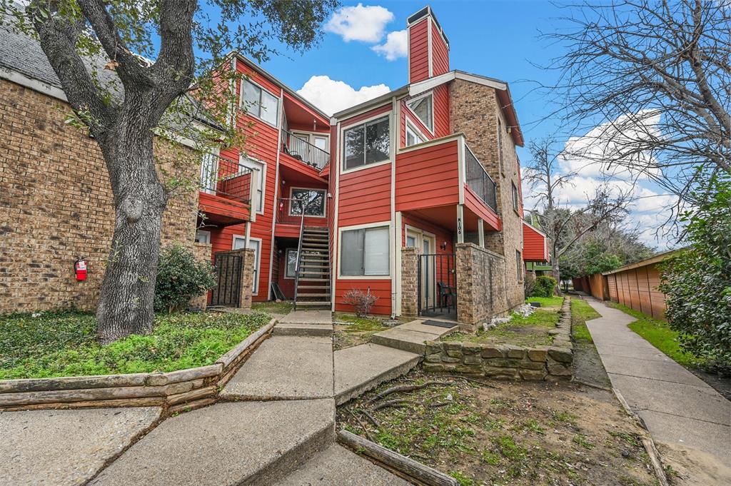 9825 Walnut Street, Unit 206 Dallas, TX 75243 - Photo 11 of 35 a view of a brick building with many windows