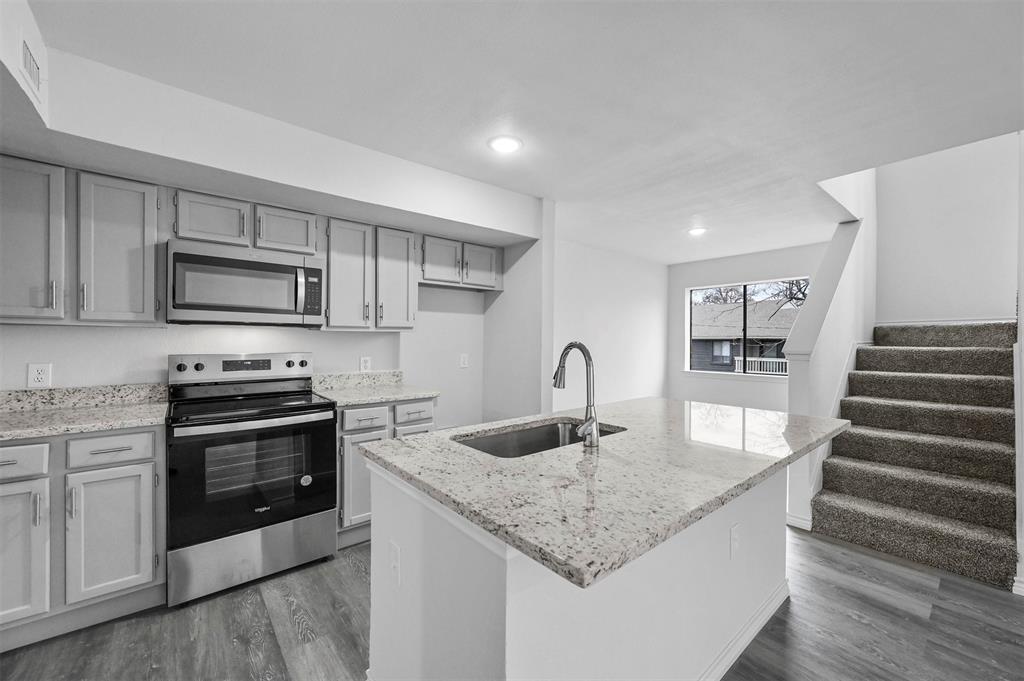 9825 Walnut Street, Unit 206 Dallas, TX 75243 - Photo 14 of 35 a kitchen with sink a microwave and stove