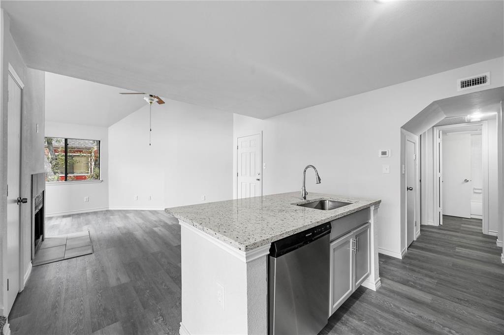 9825 Walnut Street, Unit 206 Dallas, TX 75243 - Photo 20 of 35 a kitchen with a sink and cabinets