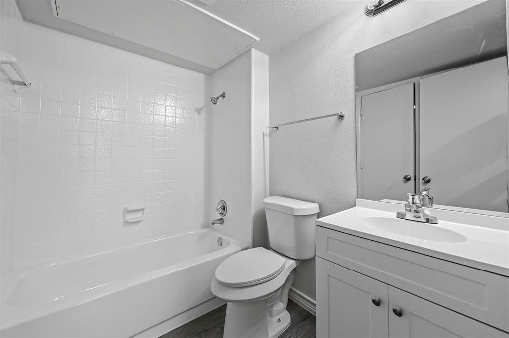 9825 Walnut Street, Unit 206 Dallas, TX 75243 - Photo 24 of 35 a bathroom with a sink toilet and shower