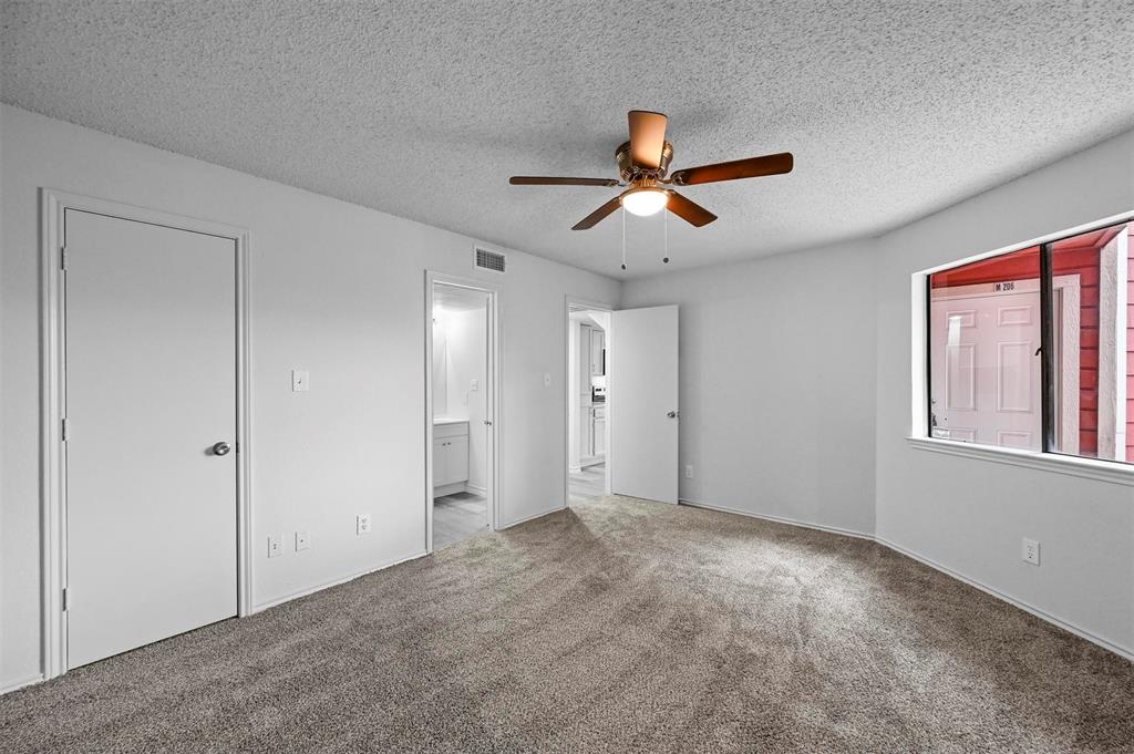 9825 Walnut Street, Unit 206 Dallas, TX 75243 - Photo 27 of 35 a view of room with a ceiling fan and window