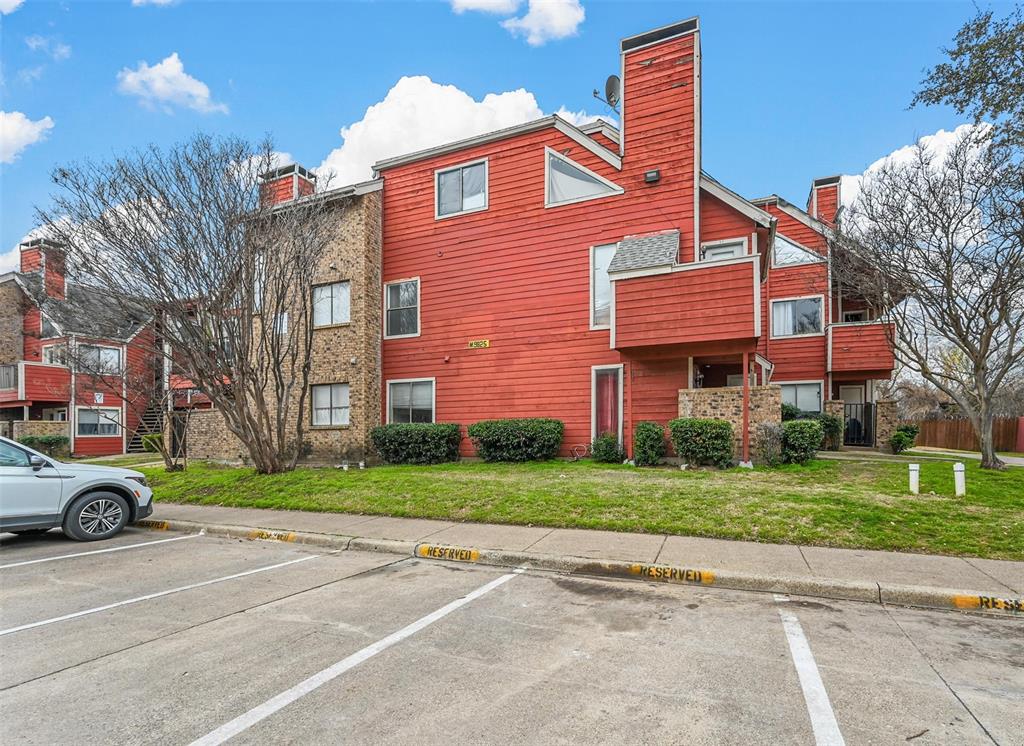 9825 Walnut Street, Unit 206 Dallas, TX 75243 - Photo 3 of 35 a red brick building with trees in front of it