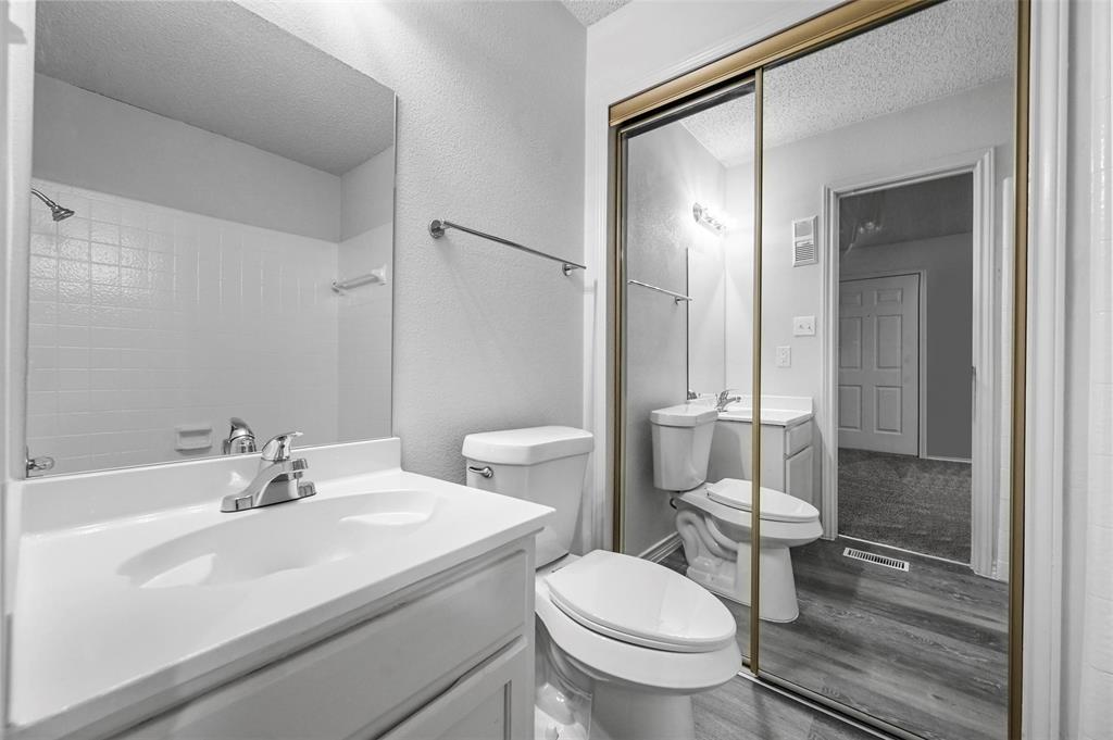 9825 Walnut Street, Unit 206 Dallas, TX 75243 - Photo 31 of 35 a bathroom with a sink toilet and shower