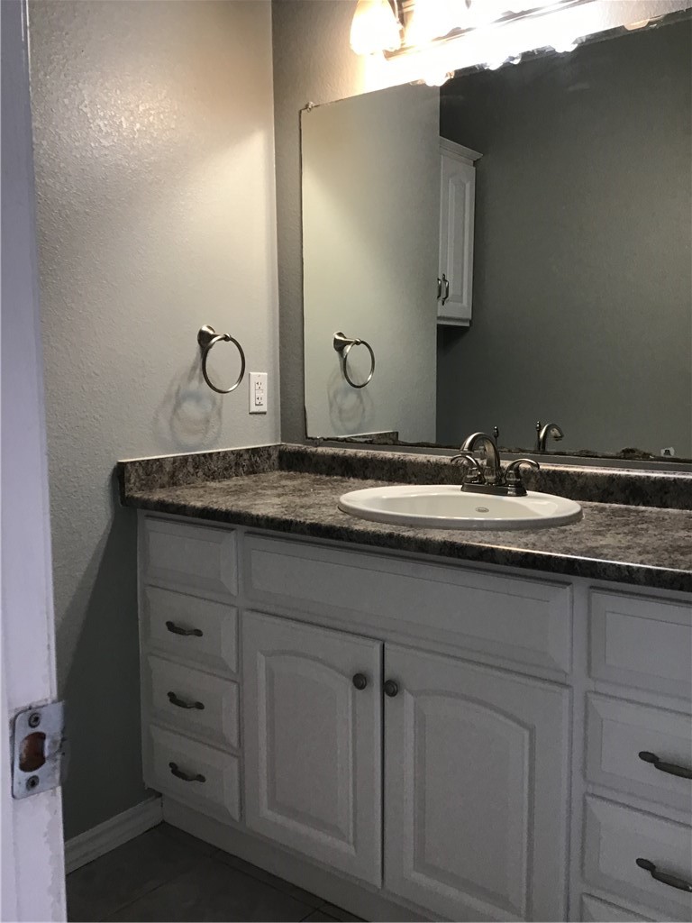 13409 Saddlebrook Trail, Unit A Austin, TX 78729 - Photo 11 of 21 a sink with a granite countertop