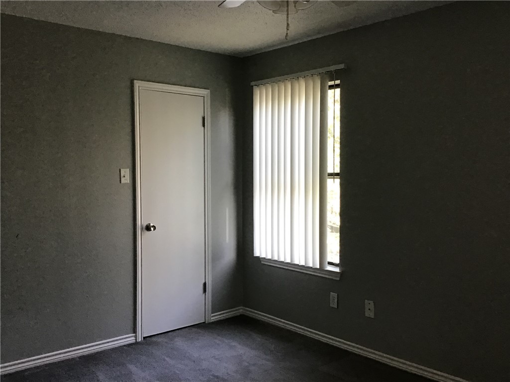13409 Saddlebrook Trail, Unit A Austin, TX 78729 - Photo 15 of 21 an empty room with windows