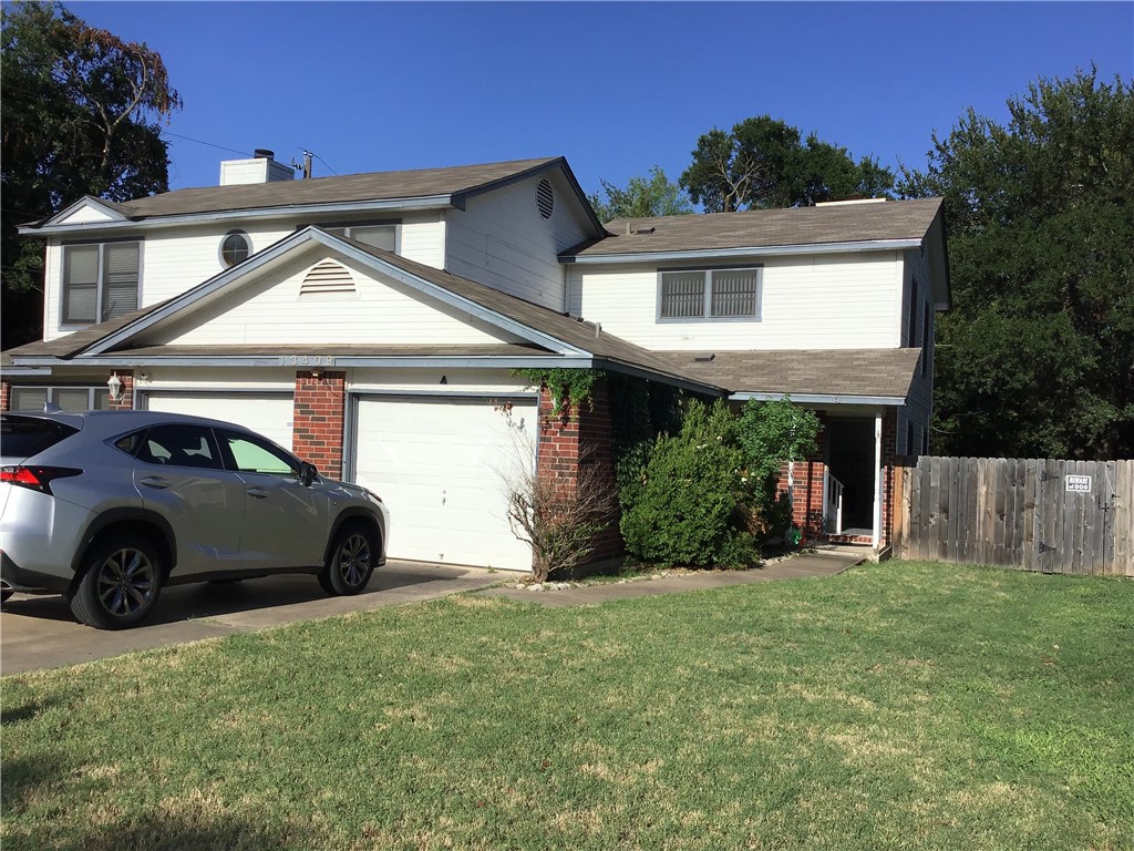 13409 Saddlebrook Trail, Unit A Austin, TX 78729 - Photo 20 of 21 a house view with a garden space